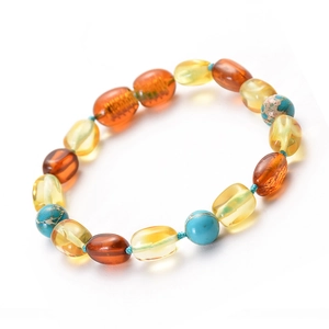 Natural Baltic amber baby bracelet with turquoise beads on light blue cord