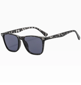 Detail view of square marble texture frame sunglasses with silver rivets and grey lenses