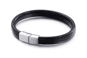 Detail of black textured leather bracelet with a polished silver magnetic clasp