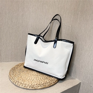 Minimalist black and white tote bag with long handles for daily commuting and shopping