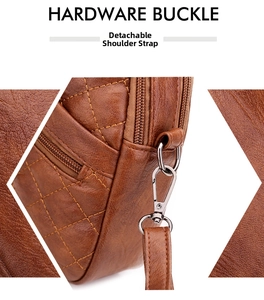 Detail of silver hardware buckle and removable strap on brown quilted leather crossbody bag