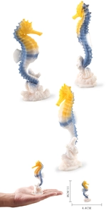 Close-up of yellow and blue seahorse model on white coral base with dimension details