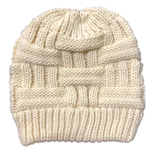 Detailed close-up of cream knit ponytail beanie with textured grid pattern and ribbed cuff