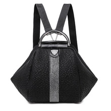 Detail of black faux leather backpack with vertical sequin stripe and metal top handle