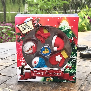 Close-up of 5-piece cartoon Christmas eraser set with Santa, snowman and gift box