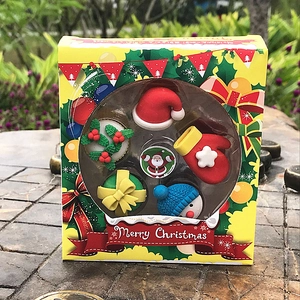 Detailed view of a Christmas eraser set with festive icons in a yellow window gift box
