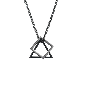 Close-up of interlocking geometric square and triangle pendants in dark grey titanium