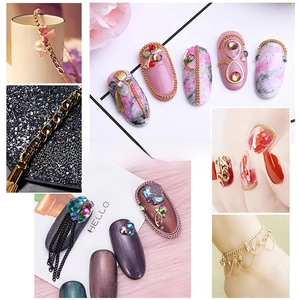 Detail of Japanese nail art kit featuring gold metal chains pearls and rhinestones