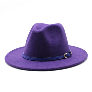 Close-up of deep purple wool fedora hat with blue faux leather band and gold buckle