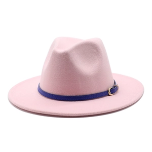 Detail of pink wool fedora hat with navy blue leather strap and golden buckle buckle
