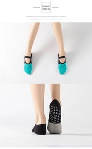 Detail view of lace-up yoga socks featuring a cat pattern and non-slip silicone grip dots