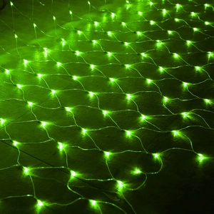 Close-up of green LED net lights showing glowing bulbs on a transparent mesh grid