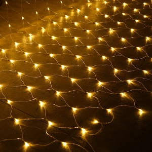 Detail view of warm white LED net light with uniform mesh structure on dark ground