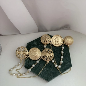 Baroque style gold-finish brooch with antique coins and multi-layer pearl chains