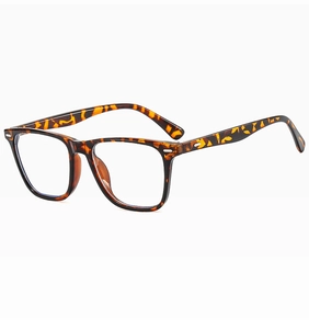Detail view of tortoiseshell square frame sunglasses with metal rivet accents