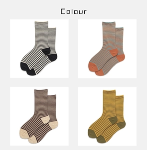 Detail showing four color combinations of classic striped cotton crew socks for women