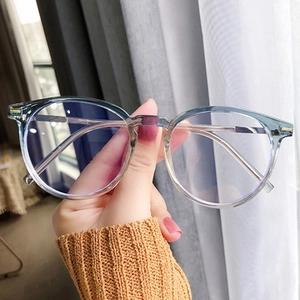 Detail of oversized square sunglasses with blue gradient lenses and wide temples