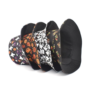 Halloween bucket hats with ghost and pumpkin patterns on a clean white background