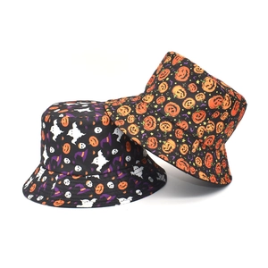 Detail of Halloween bucket hats showing white ghosts and orange pumpkin pattern prints