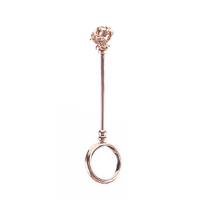 Detailed view of a rose gold cigarette holder ring with a 3D flower decorative top