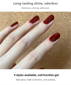 Macro shot of mirror-finish dark red nail polish showing high-gloss reflection and texture