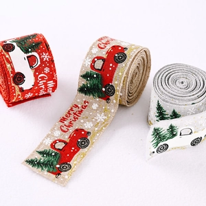 Three rolls of Christmas ribbon with red vintage truck and tree patterns for tree decor