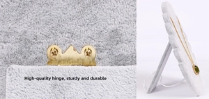 Detail of the golden metal hinge and velvet jewelry display stand for necklaces