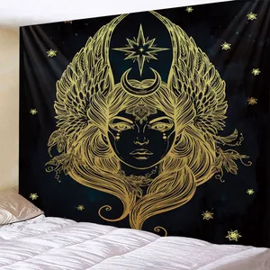 Detailed view of black and gold goddess tapestry on a bedroom wall with celestial stars