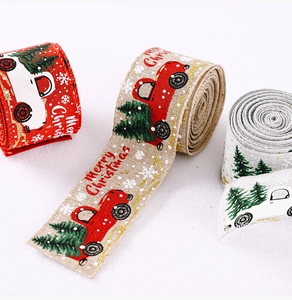 Three rolls of Christmas linen ribbons with vintage car tree prints on white background