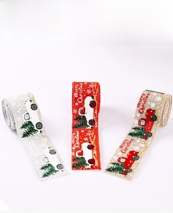Detailed view of Christmas ribbons featuring vintage truck and snowflake patterns