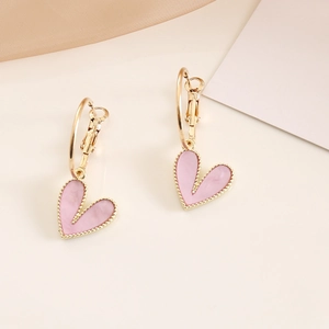 Detailed macro view of pink marble heart pendant earrings with gold beaded edges