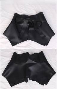 Front and back detail of wide black leather corset belt with a lace-up bow closure