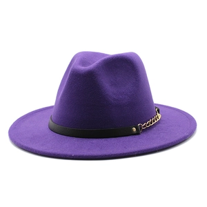 Detailed shot of purple wool fedora featuring a black leather band and gold chain link