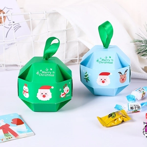 Star-shaped Christmas candy boxes in green and blue with Merry Christmas prints and ribbons