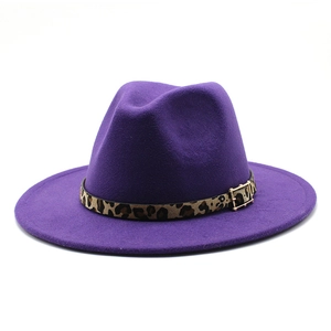 Detail of purple wool fedora hat with leopard print band and gold buckle accent