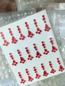 Detailed view of red teardrop rhinestone stickers for kids face makeup and DIY crafts