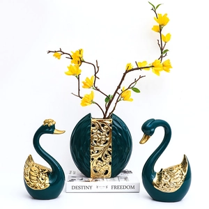 Three-piece teal ceramic swan and vase set with golden accents for luxury home decor