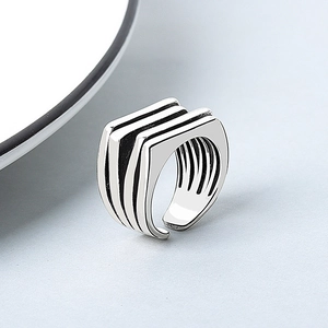 Irregular multilayer silver adjustable open ring with a minimalist geometric metal design