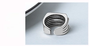 Detailed view of silver multilayer irregular ring showing adjustable open back design