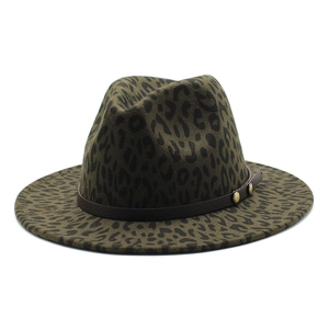 Detail of dark green leopard print fedora with leather band and gold metal rivets