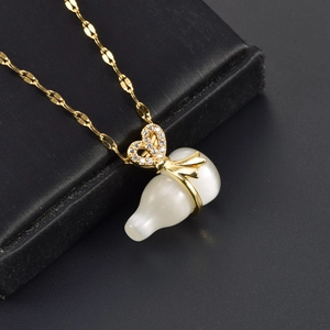 Detailed view of a gold-plated necklace with opal gourd pendant and zircon bow detail