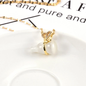 Elegant gold-plated opal gourd necklace with a sparkling diamond-encrusted bow pendant