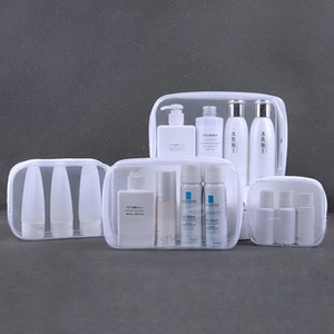 Detailed set of four transparent PVC makeup bags in various sizes for travel storage