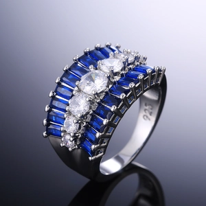 Macro shot of 925 silver ring with blue trapezoid stones and white round zircons