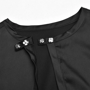 Detail of metal snap button closure on premium black fabric crop top neck area