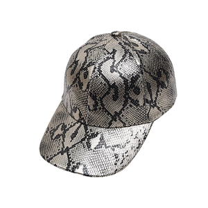 Faux leather baseball cap featuring grey snakeskin print and curved brim in street style