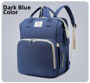Detail view of the dark blue diaper bag with YOU ARE MY SUNSHINE patch and pockets