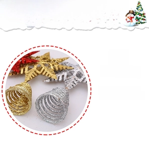 Detailed view of hollow iron Christmas tree star and bells with gold and silver glitter finish