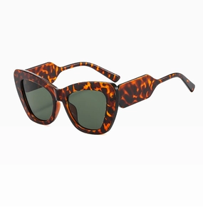 Detail of oversized cat eye sunglasses with tortoise frame and thick geometric temples