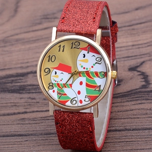 Christmas snowman quartz watch with gold case and red glitter leather strap on wood